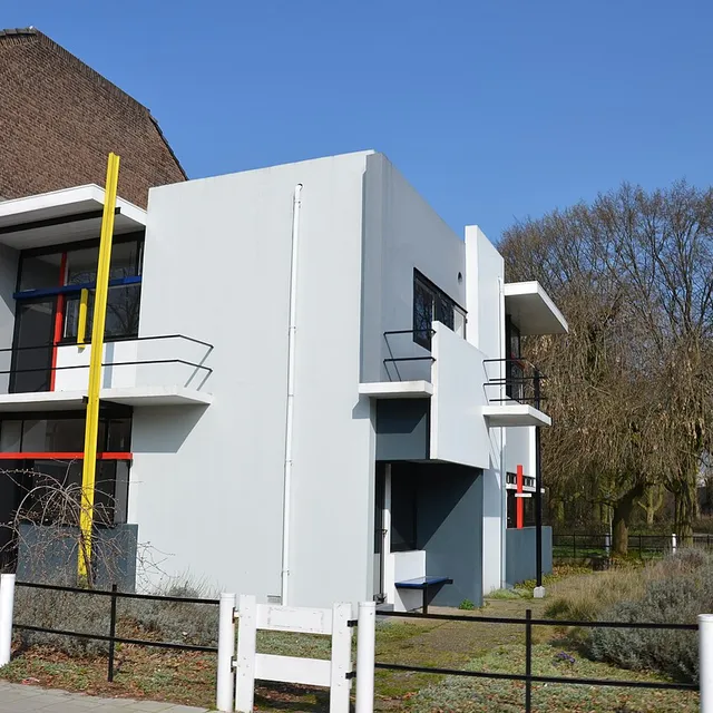 The Rietveld Schröder House seen from the street corner, with its yellow post and red and blue bars